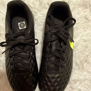 Black and neon green cleats